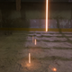 Weld spatter falling from the floor above into a powdered limestone filler mess.